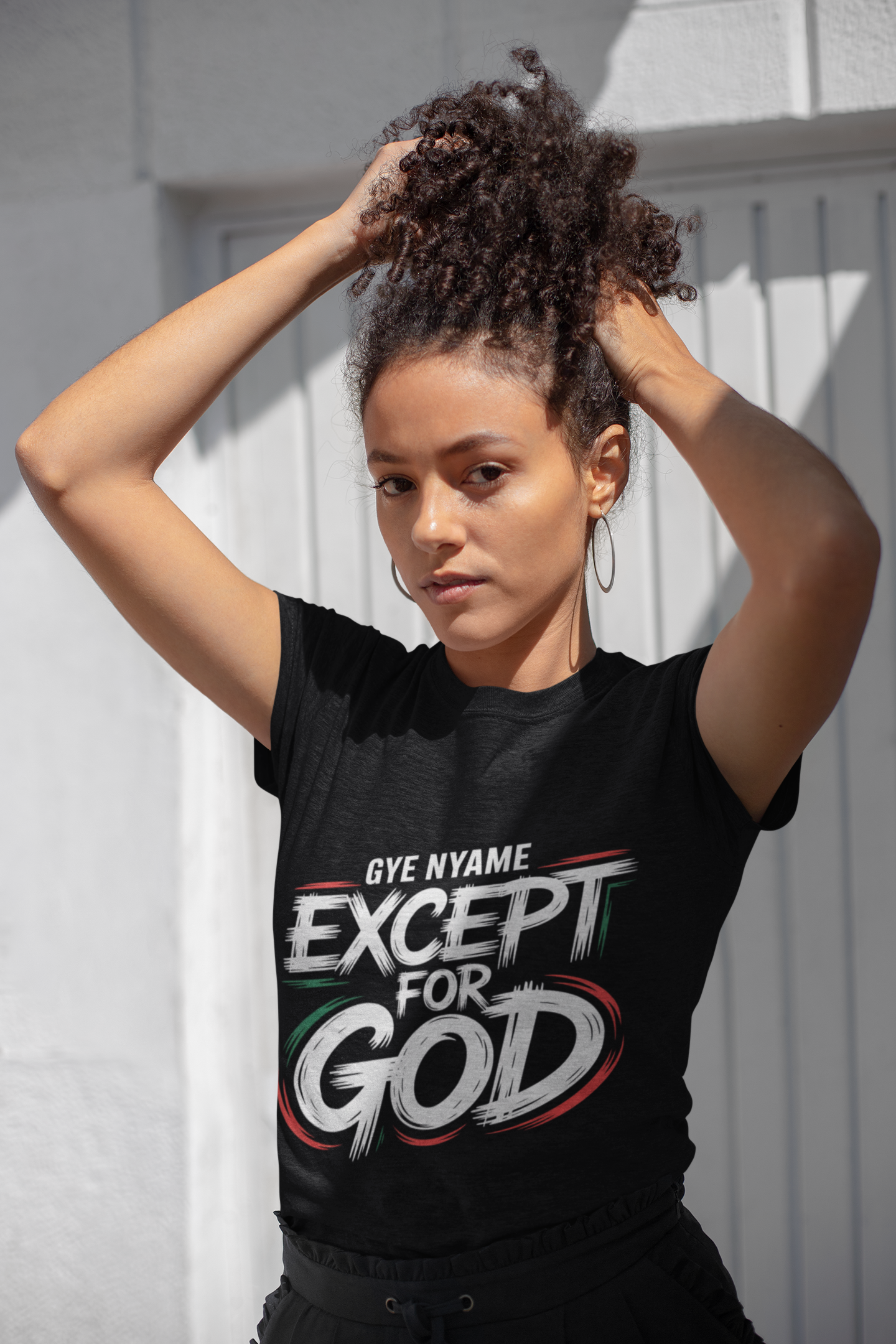 Black t-shirt with a white Gye Nyame Adinkra symbol design, representing the omnipotence of God and spiritual protection.